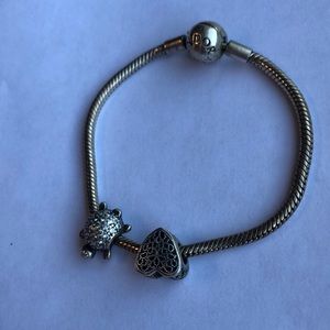 Pandora bracelet with two charms.
